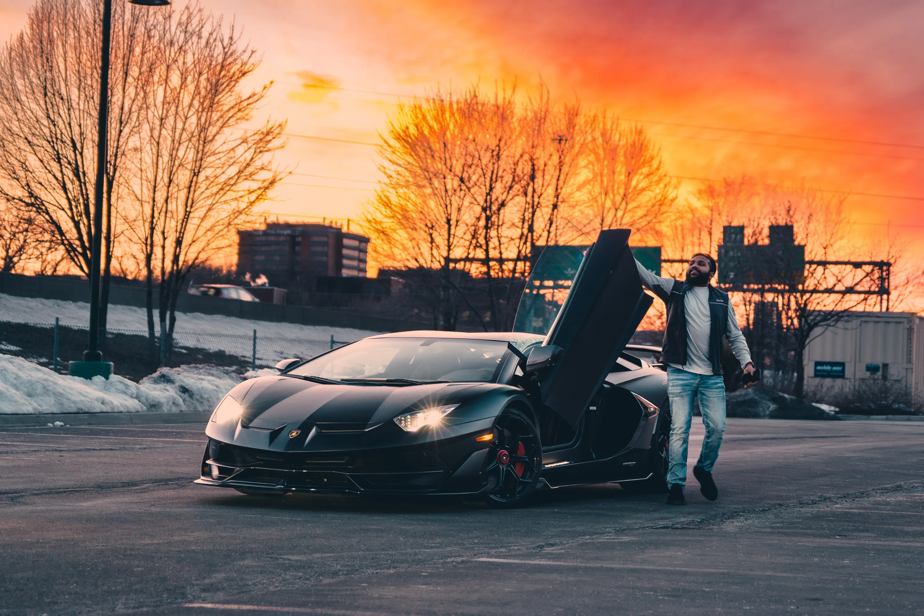 Mo with his Lamborghini at sunset